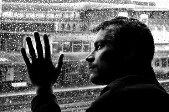 a man looking out a window