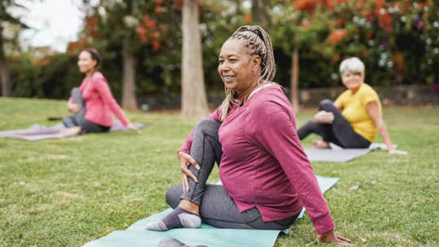 women exercise class in a park